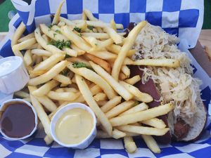 Brat with fries at Hinterhof in Los Angeles