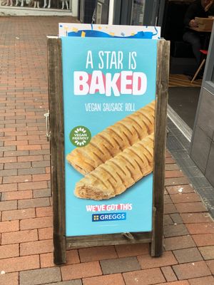 Advertising the vegan sausage roll at Greggs - High St in Chatham
