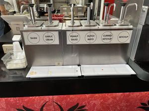 Sauces, tahini, peanut sauce., curry ketchup and ketchup are all vegan  at Amsterdam Falafelshop in Miami