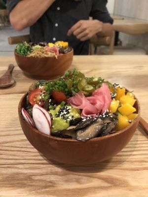 Mushroom, mango, ginger, radish, tomato, guacamole, jalapeños, seaweed, edamame, sushi rice and soy sauce.  at Poke Hanoi in Hanoi