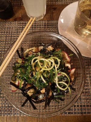 Bowl with zoodles, reddish, nori leaves, wakame, macadamia, smoked tofu, edamame at Local in Lisbon