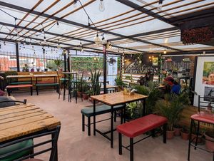 Seating area at Pizzeria Amici Miei La Floresta in Quito