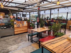 Seating area at Pizzeria Amici Miei La Floresta in Quito