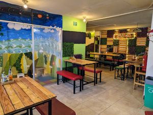 Indoor seating area at Pizzeria Amici Miei La Floresta in Quito