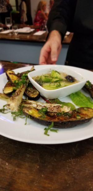 Grilled eggplant w/ house cured cucumbers & grapes. at Daniel's Table in Cathedral City