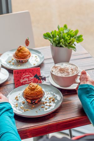 Pumpkin muffin with Pumpkin orange spice latte with creme at Healthy Louisa in Leicester