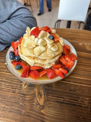 Pancakes with bananas, strawberries, blueberries and maple syrup   at Healthy Louisa in Leicester