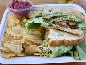 Tempeh BLT Sandwich and Potato Chips with Beet Humus  at Raised by the Waves  in Kahuku