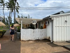 The restaurant is tucked back around the left from the main driveway at Raised by the Waves  in Kahuku