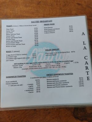 Breakfast menu at Aadha-Aadha Café in Varanasi