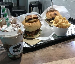 First time I went - chocolate milkshake, I think the burgers were called pulled pork (?) and herbivore, and curly fries.  at GrassfedVegan in South Brisbane