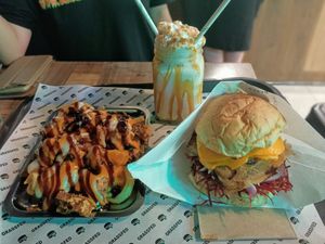 Loaded fries, Aussie burger, and caramel/cookie-dough shake at GrassfedVegan in South Brisbane