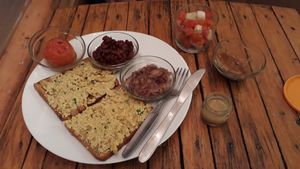 All-day served vegan breakfast (tofu scramble, oinons, potatoe wafer, baked beans, baked tomato and salad) at Mark's Cafe in Varanasi