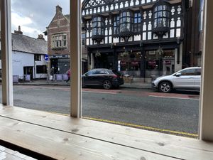 1911 firehouse is the view while you sip on your latte  at Jaunty Goat Coffee - Northgate St in Chester