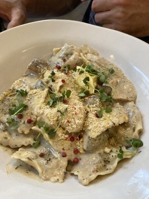 Pumpkin ravioli served with sage butter sauce & house made cashew parmesan  at Stem & Glory in London