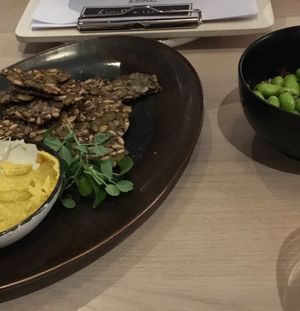 Hummus and crackers | edamame  at Stem & Glory in London