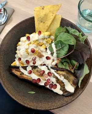 Chickpea, tofu, eggplant curry with polenta wedges at Stem & Glory in London