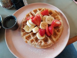 Vegan waffle with strawberries, banana and maple syrup. at Chi Chi's in North London
