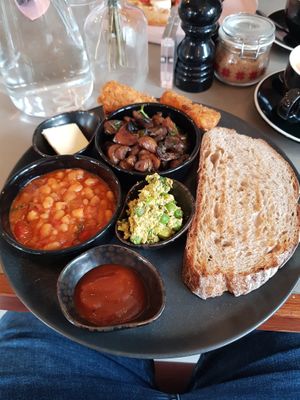 Vegan Breakfast: Vegan butter, hash browns, mushrooms, beans, smashed peas, sourdough toast, homemade ketchup jam. at Chi Chi's in North London