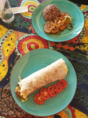 tempeh steak (vegan) and bean burrito. at Imas Vegetarian Restaurant in San Vincente Palawan