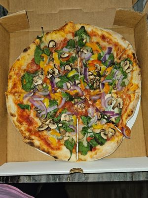 Red sauce, vegan mozzarella, mushroom, spinach, bell pepper, onion at Freak Brothers Pizza in Phoenix