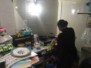 The small kitchen space is at the back of the restaurant. Some menu items are brought into the restaurant after you order them, but it appears that all are cooked/heated in house. at Happy Platters in Dong Hoi