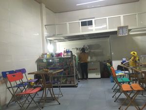 The seating area includes interior and exterior tables, though it should be noted that the entire restaurant is open through the large roll-down front door. at Happy Platters in Dong Hoi