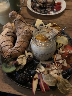 Sweet breakfats with fruits, croissants and soy/mango yoghurt. at Veg room in Berlin