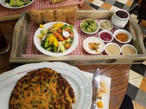 Vegan breakfast plate. Vegan omlette, yogurt and jam, bread, and a ton of spreads! at Cafe Landwer - University Ave in Toronto