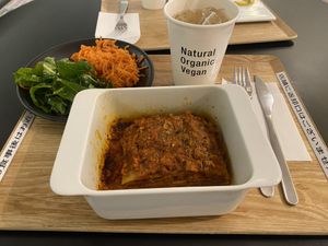 Lasagna set comes with 2 salads and a drink. This is kale and carrots salads with homemade ginger ale    at HND - HealthyTOKYO Cafe & Shop - T2 in Tokyo