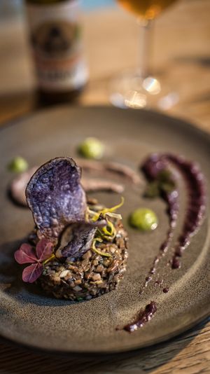 Mushroom tartar, black bean cream, red onion and fig jam, rocket leaves at Rataskaevu 16 in Tallinn