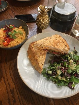 Yummy toasted vegan sandwich with falafel, roasted veggies and hummus, side salad and sun-dried tomato couscous 😋 at The Emporium in Yeovil