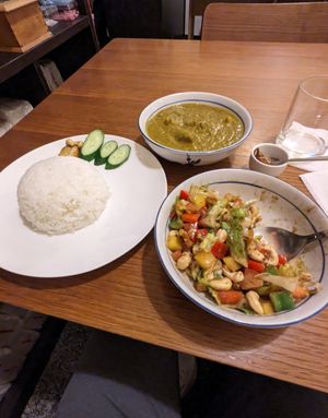 Tempeh curry & a partially-eaten side cashew salad at Veganersworld 莘咖哩  in Tainan