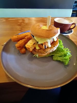 Mushroom tofu bagel with hollandaise and hash stack. Full vegan. Soy latte ❤️ at Munch in Palmerston North