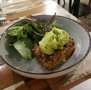 Corn cake with guac & side salad. at Munch in Palmerston North