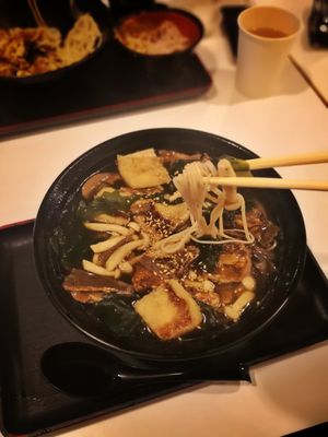 Several types of mushrooms, fried tofu and wakame seaweed in a broth filled with lovely mushroom flavour. at Healthy Soba IKI in Central Singapore