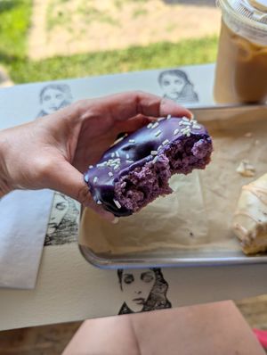 Ube donut "cross-section" via a couple of bites--it's purple on the inside, too! at Drift Dough in Rochester
