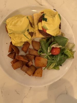 Hollandaise Benny Sausage with home fries   at Community Restaurant in Oakville