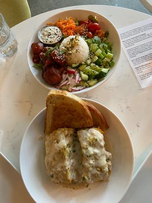 Buffalo Cauliflower Salad above and cheesy Lasagna below with bread.   at Community Restaurant in Oakville