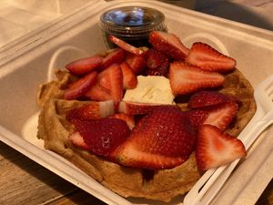 Mmm, classic waffle with strawberries, vegan butter, good maple syrup at ROOTED in Pleasant Hill