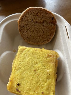 Breakfast Sammy close up on their “egg" at ROOTED in Pleasant Hill