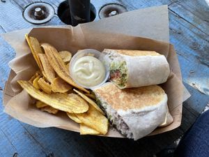 Vegan burrito w/ carrot bacon and cilantro mayo sauce; plantain chips on the side #Veganuary at Aguacate in Miami