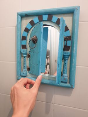 Super cute mirror in bathroom at Cabane  in Lisbon