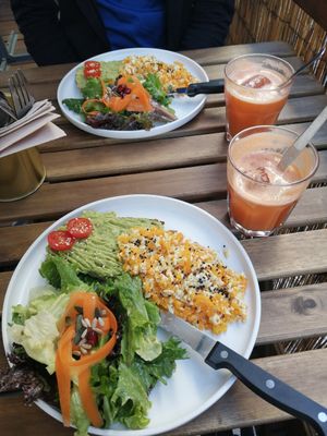 Avodado Toast with scrumbled tofu, salad and fresh orange juice at Cabane  in Lisbon