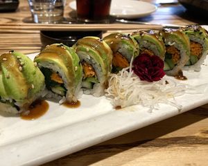 Vegan Crave Roll: carrot, spinach, asparagus, cucumber, avocado, sesame dressing 💚  at CRAVE in Edina