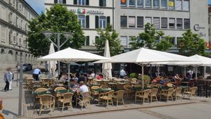 Outside seating in pedestrian zone at Molino Pizzeria Ristorante in Fribourg
