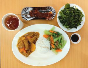 Curry, chopsuey, bbq, plate of spinach and free iced tea at Bodhi in Metro Manila