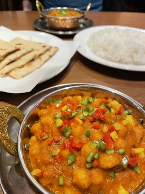 Chana masala, roti, rice, and aloo baingan dry curry. at Sapana in Hiroshima
