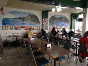 clever paintings on the seating area wall at Big Al's Healthy Foods in Tulsa