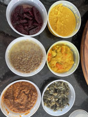 Ethiopian plate. Everything was good except the yellow lentils, which I threw in the trash because they smelled and tasted like cigarette ashes.   at Vegan Community Kitchen in Apex